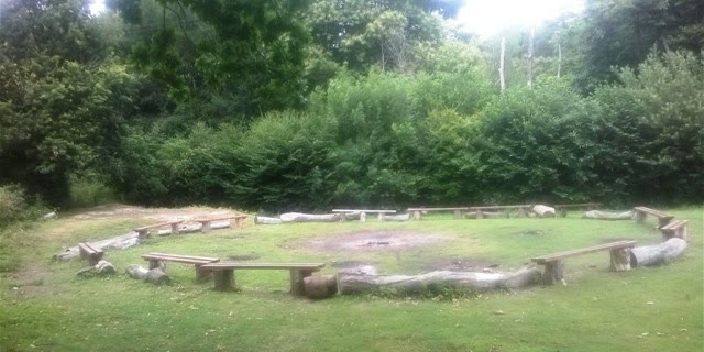 The campfire circle with its log seats